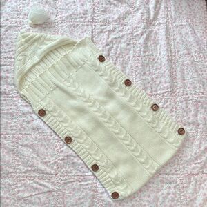 Cream sweater baby pouch